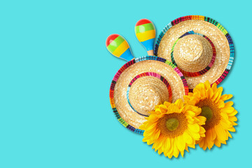 Fototapeta premium Cinco de Mayo, Two sombreros and bright sunflowers ready for a party
