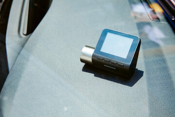 A dashcam is placed in front of the car.