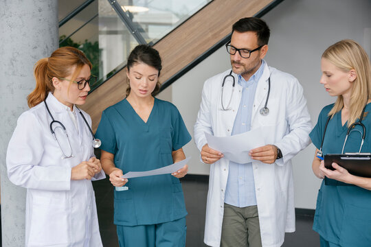 Medical team in discussion at hospital during meeting