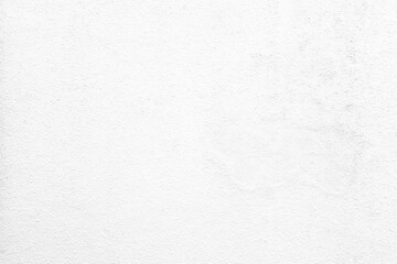 Obraz premium White plaster wall surface, used as a background for photography or graphic design.