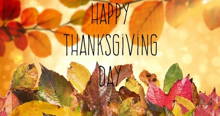 Fototapeta premium Showing center fall leaf pile forming band with warm bokeh soft branch HAPPY THANKSGIVING DAY text