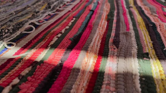Close Up of Colorful Traditional Arabic Woven Carpet with Sunbeam in Bedouin Desert Camp