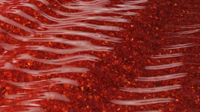 Minimalist chili condiment seamless pattern interpreted as a smooth lacquered red surface with rhythmic wave-like ripples repeating uniformly across the frame, subtle gradient shifts from ruby to dark