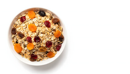 Overhead view of a white ceramic bowl filled with an inviting assortment of rolled oats, golden apricots, dark raisins, and red cranberries, isolated on a clean white background, showcasing a wholesom