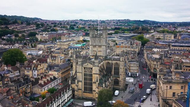 Drone aerial view looking over Bath Abbey and surrounding historic streets in the city of Bath Somerset England