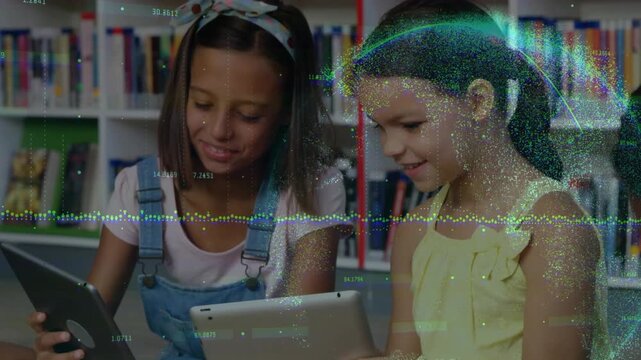 Two students tapping tablets in library, creating waveform overlay crossing faces, sharing learning