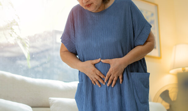 Senior or mature people suffering from digestion problem or acid reflux or heartburn.