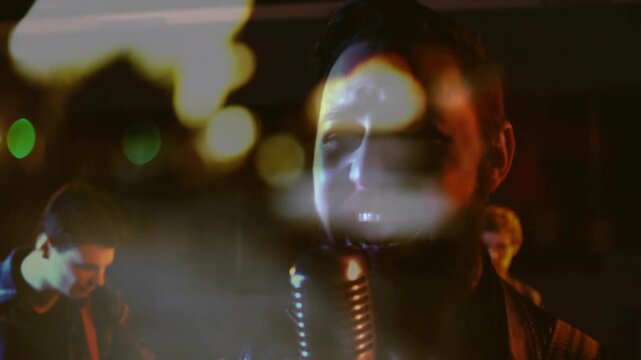 Camera cutting to four-piece rock band, lead vocalist singing into vintage mic, evoking retro vibe