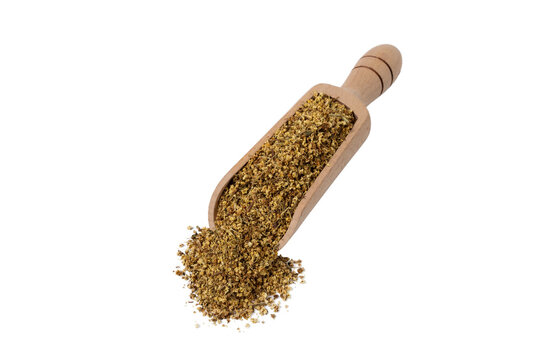 dried flowers of black lilac or black elder in latin sambuci flos in wooden scoop isolated on white background. Medicinal herb.