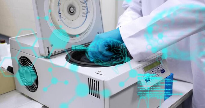 Gloved hands lifting centrifuge lid, removing adapter, seating rotor for samples with turquoise HUD