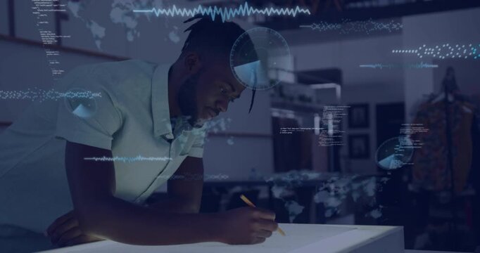 Designer leaning over light table penciling cam panning spurring HUD map radar over him for design