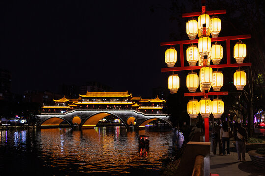 Anshun bridge and glowing chinese lanterns at night