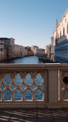 Fototapeta premium Ornate Bridge Framing Scenic View of Venice Canals and Architecture Under Blue Sky
