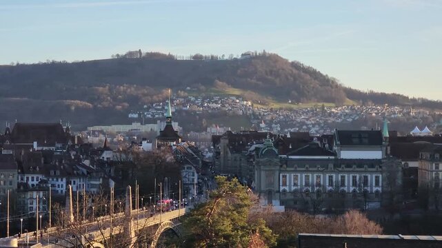 Panning panoramic footage of Bern, capital city of Switzerland, on a winter sunny day with the snow covered Alps peaks in the background.