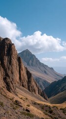 Fototapeta premium Majestic Mountain Peak Surrounded by Rugged Mountain Landscape Under Clear Blue Sky