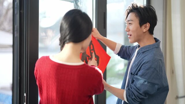 Young couple celebrating Chinese New Year together