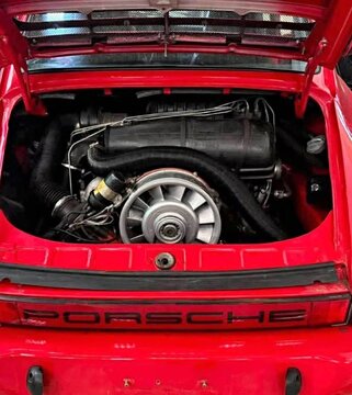Red Porsche 911 air-cooled flat-six engine bay