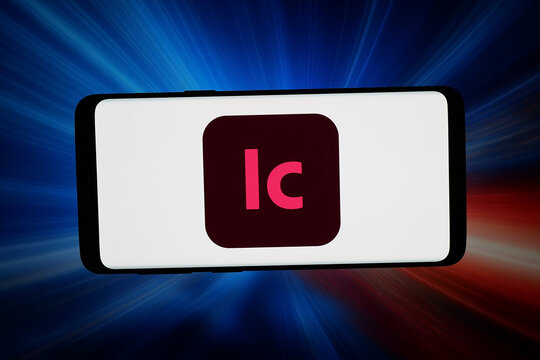 Stuttgart, Germany - 03-02-2026: In this photo illustration, the logo of word processing software Adobe InCopy is displayed on a smartphone in front of abstract background on computer screen.