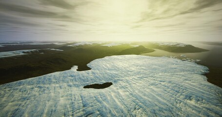 Aerial glacier sunrise bathed in golden light showing textured ice, scattered melt ponds, distant dark shoreline, atmospheric clouds and warm horizon, ideal © icetray