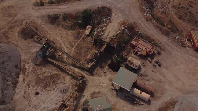 High angle view of buildings and equipment of a large mining quarry in Abuja, Nigeria on a sunny day