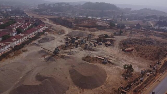 Stunning aerial overview of a large mining quarry at the edge of Abuja, the capital city of Nigeria, FTC, Africa