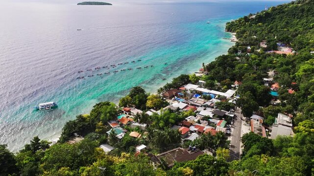 Oslob, Philippines, whale shark watching boats, vibrant green hillside village