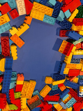 Colorful building blocks framed around blue center