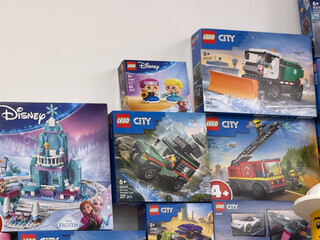 Fototapeta premium Stacked lego city and disney frozen boxes