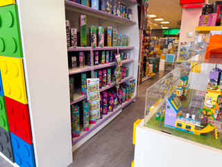 Fototapeta premium Colorful toy store aisle with boxed playsets