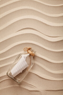 a bottle with the message on the sand