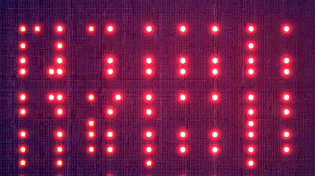 Advancing frames causing LED panel pulsing red pixels inside dark navy case showing grid shift
