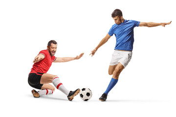 Football players in action, one performing a tackle