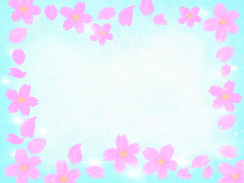 空の水色を背景にキラキラとした桜の花びらのフレームイラスト