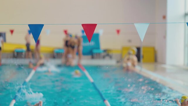 Indoor swimming pool with pennant flags during competition