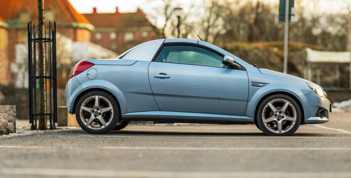Gothenburg, Sweden - February 01 2026: Side profile of blue Opel Tigra Twintop convertible coupe.