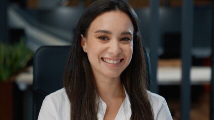 Fototapeta premium Portrait Caucasian business woman smiling looking at camera working in marketing company office European businesswoman smile cheerful girl joyful female carefree specialist professional lady agent