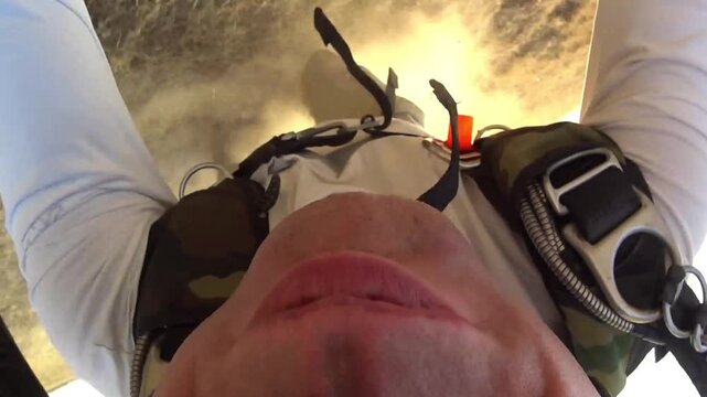 Accident during landing of a parachutist in a field. Point of View.
