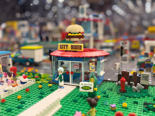 Naklejka premium Lego city diner with hamburger sign
