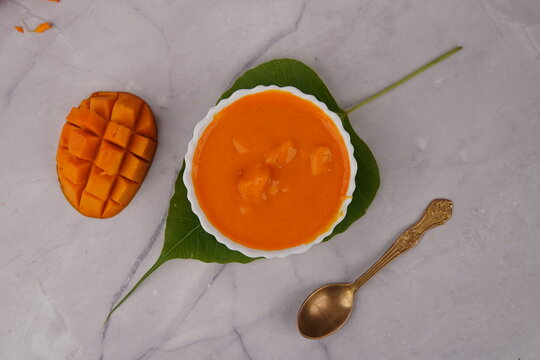 Delicious Hapus Aamras made from ripe Alphonso mangoes, known for their rich aroma, bright golden color, and naturally sweet flavor. This traditional Indian mango pulp dessert is popular in Gujarati a