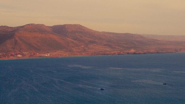 Panorama of Imsouane bay. Sunrise at the beach with surfers in morocco. beautiful lines with waves