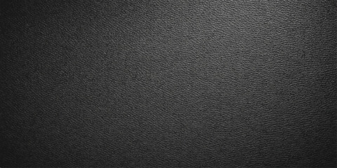 Fototapeta premium A dark textured black leather surface material features a detailed macro pattern and rough textile structure, creating a grey stone-like backdrop for a sophisticated design cover or wallpaper