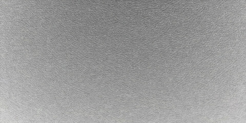 Fototapeta premium A blank grey metal and white paper surface featuring a rough brushed aluminum pattern and textured cardboard material for a grunge steel wall art backdrop