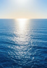 Obraz premium Bright sunlight reflecting off the vast ocean surface, creating glittering, sparkling waves and a deep blue color stretching to the horizon, vacation, movement, sun