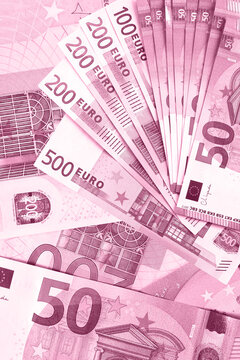 Banknotes of European Union. Money background in pink color