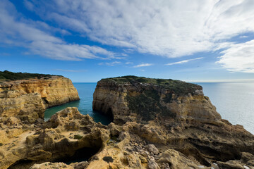 Rocky coastline, colorful cliffs, ocean, Portugal