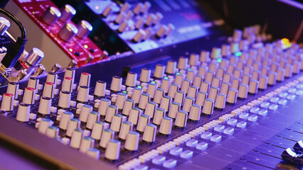 Obraz premium Studio Mixing Console Displays Numerous Knobs And Sliders. Audio Equipment, Music Production, Recording Technology, Creative Industry.