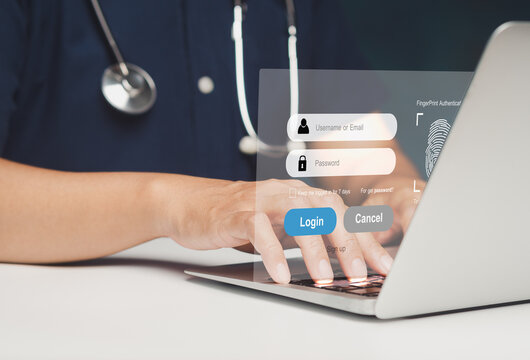 Doctor using laptop with healthcare login interface