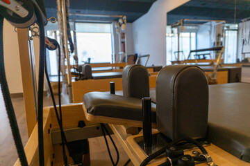 Pilates studio with reformers ready for exercise and wellness training