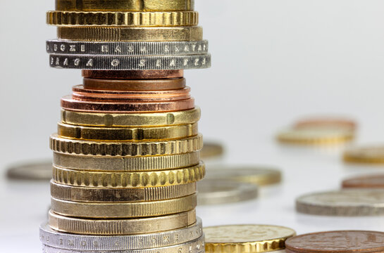 Stack of different nominal Euro coins with copy space