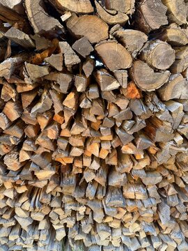 stacked firewood in front of a biomass power plant - texture